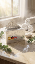 AuraSmile whitening strips box with individual strip sachets on a bathroom counter